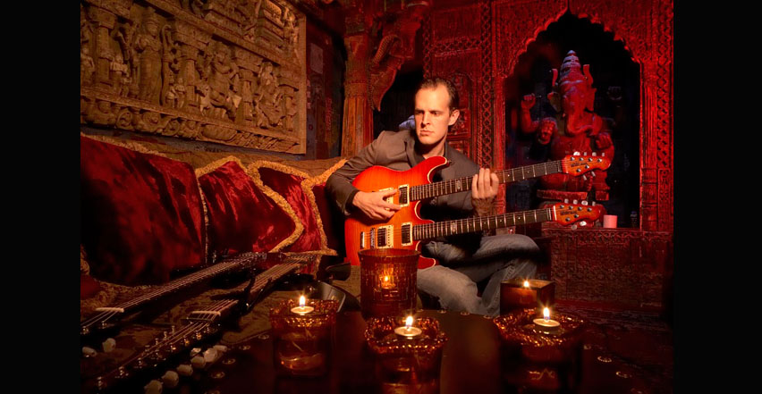 Location photography of Joe Bonamassa at House of Blues Hollywood Foundation Room with double neck guitars
